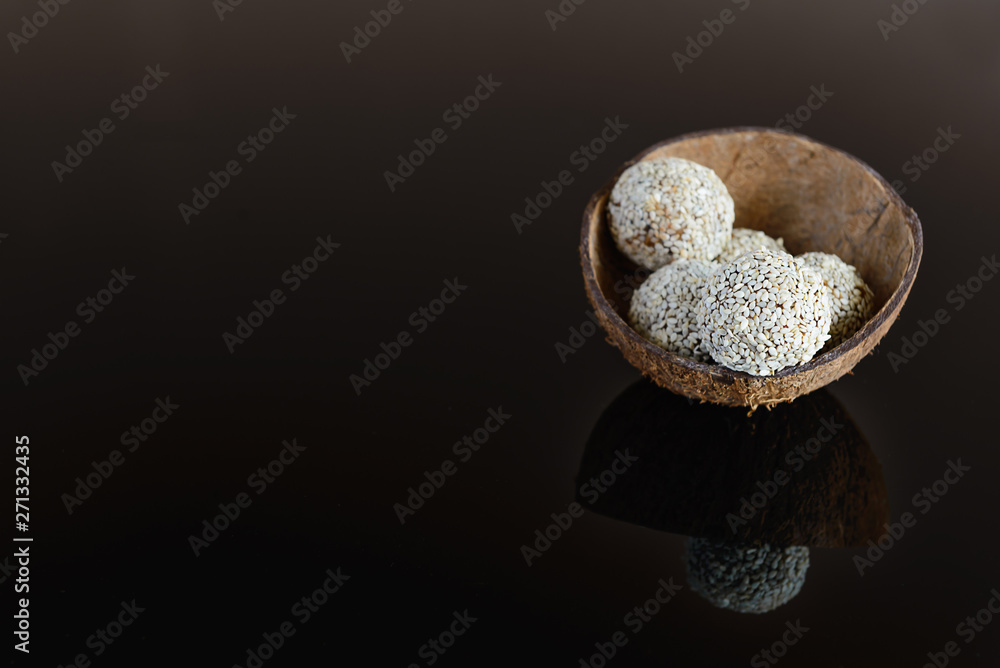 Energy balls of date fruitss and nuts. Raw dessert on a dark background. Energy balls of date fruitss and nuts. Raw dessert on a dark background.