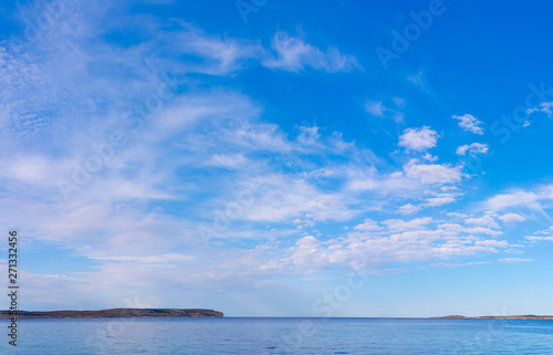 Panoramic view of Comino from Malta.Sea sunset with colorful cloud..