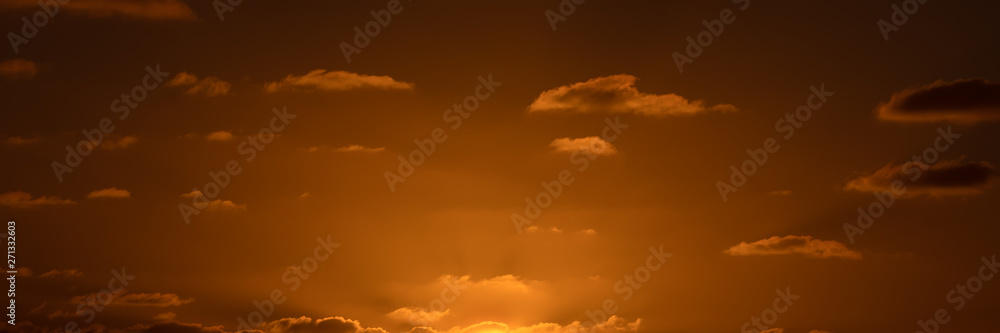 Beatiful sunset above the mediterranean sea. Sunrise with red and orange skies and the sun shining. Bright sun with dark background