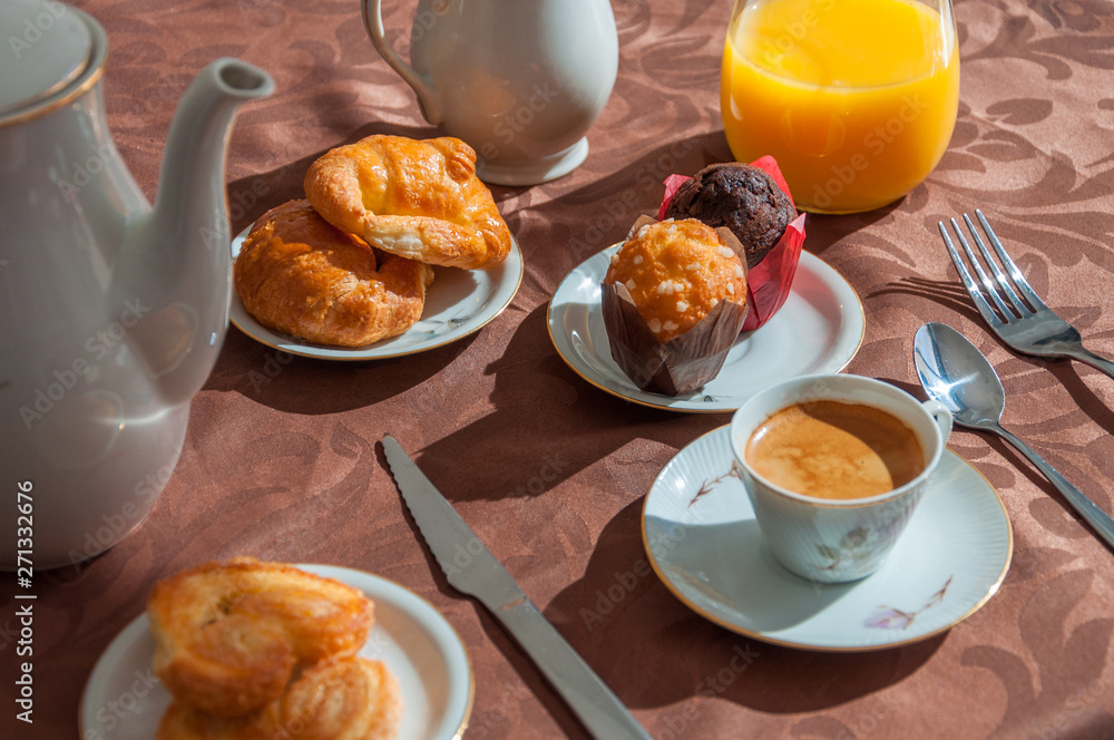 Closeup of breakfast with coffee, orange juice and pastry. Closeup of breakfast with coffee, orange juice and pastry.