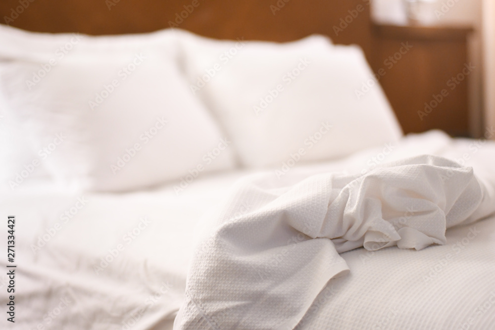 white pillows on a bed white pillows on a bed