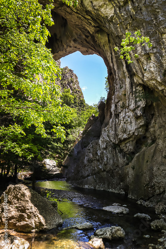Natural stone bridge in Vratna river gorge in Serbia, called Vratnjanske kapije. This arches is a largest natural bridges in Europe.