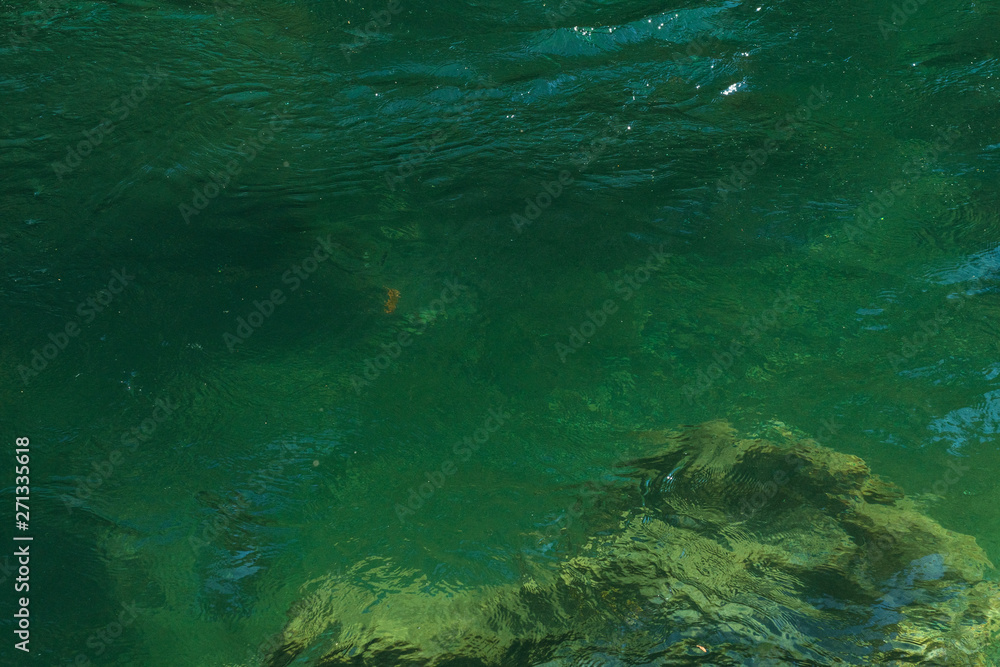 Detail of the turquoise water of the Skagit River and the rocks under it