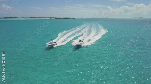 drone bird view of 2 boats in the bahamas. summer vaction
