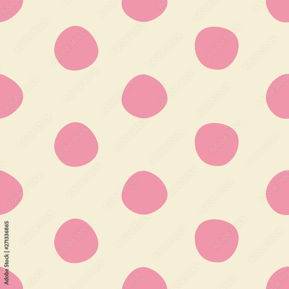 Cute pink dots seamless pattern in pink and light beige. Imperfectly round polka dot all over print design is great for fashion, textiles, wallpaper, gift wrapping paper and home decor items. Vector.
