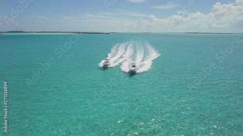 drone bird view of 2 boats in the bahamas. summer vaction