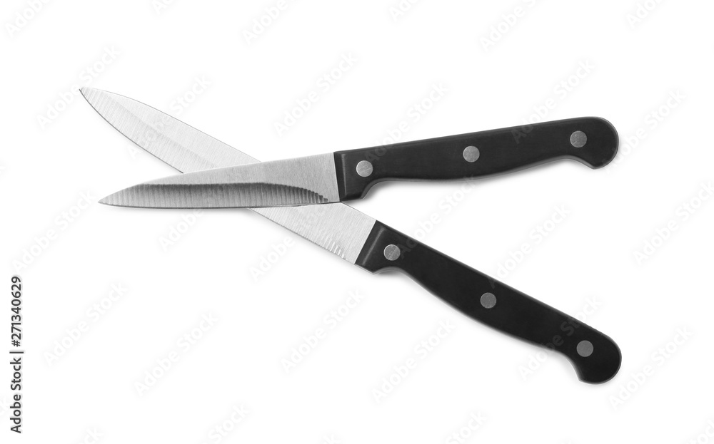 Stainless steel knives on white background, top view Stainless steel knives on white background, top view