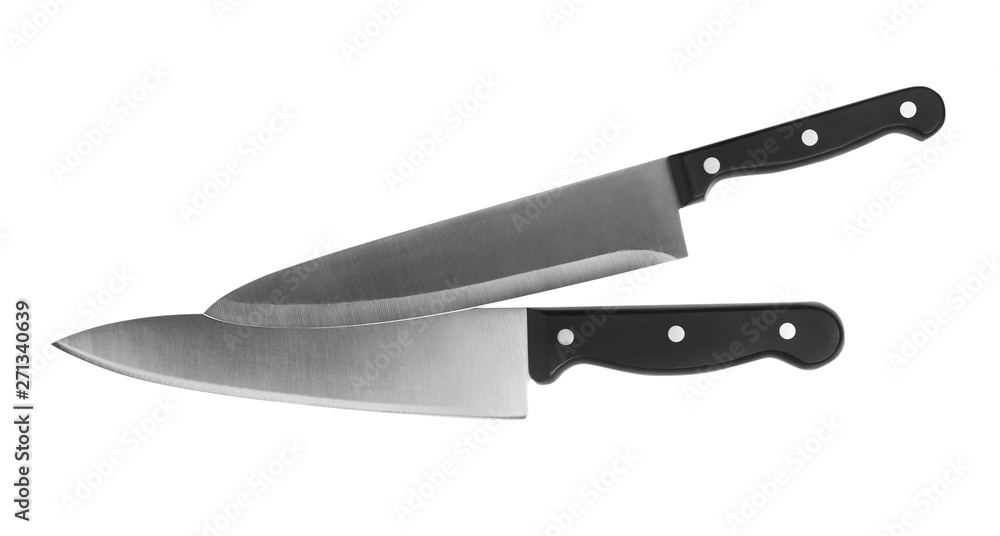 Stainless steel chef's knives on white background, top view Stainless steel chef's knives on white background, top view