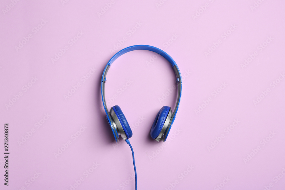 Stylish headphones on color background, top view Stylish headphones on color background, top view