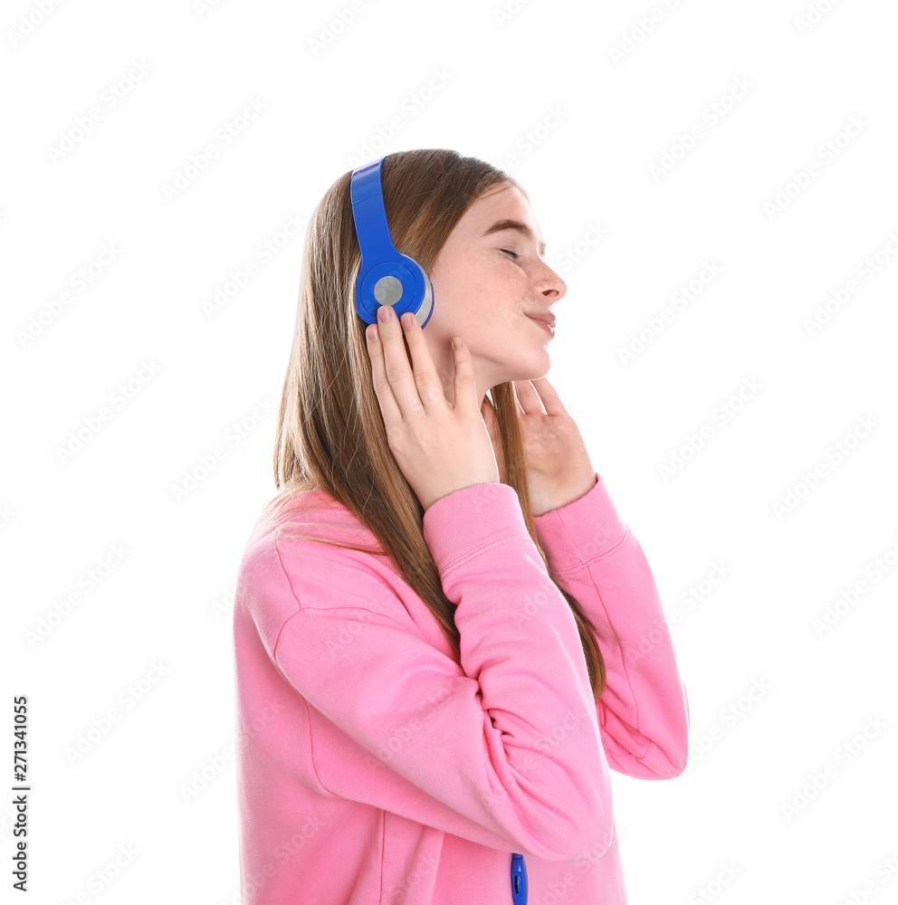 Naklejka premium Teenage girl enjoying music in headphones on white background