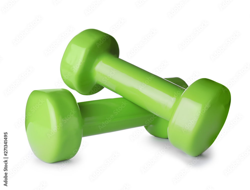 Color dumbbells on white background. Home fitness Color dumbbells on white background. Home fitness