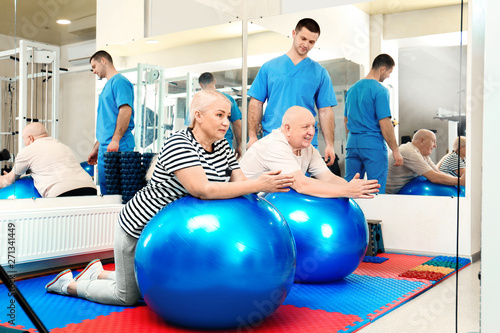 Patients exercising under physiotherapist supervision in rehabilitation center