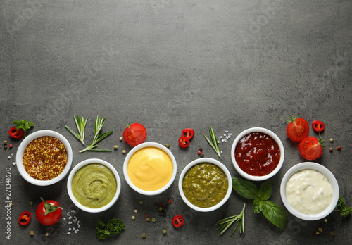 Wallpaper Mural Bowls with different sauces and ingredients on gray background, flat lay. Space for text Torontodigital.ca