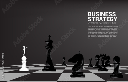 Silhouette of businessman point forward with chess piece. concept of business strategy marketing.