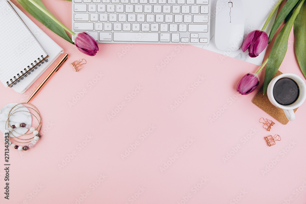Flat lay, top view office table desk frame. Feminine desk workspace with succulent, laptop, glasses, diary and golden clips on pink background Flat lay, top view office table desk frame. Feminine desk workspace with succulent, laptop, glasses, diary and golden clips on pink background
