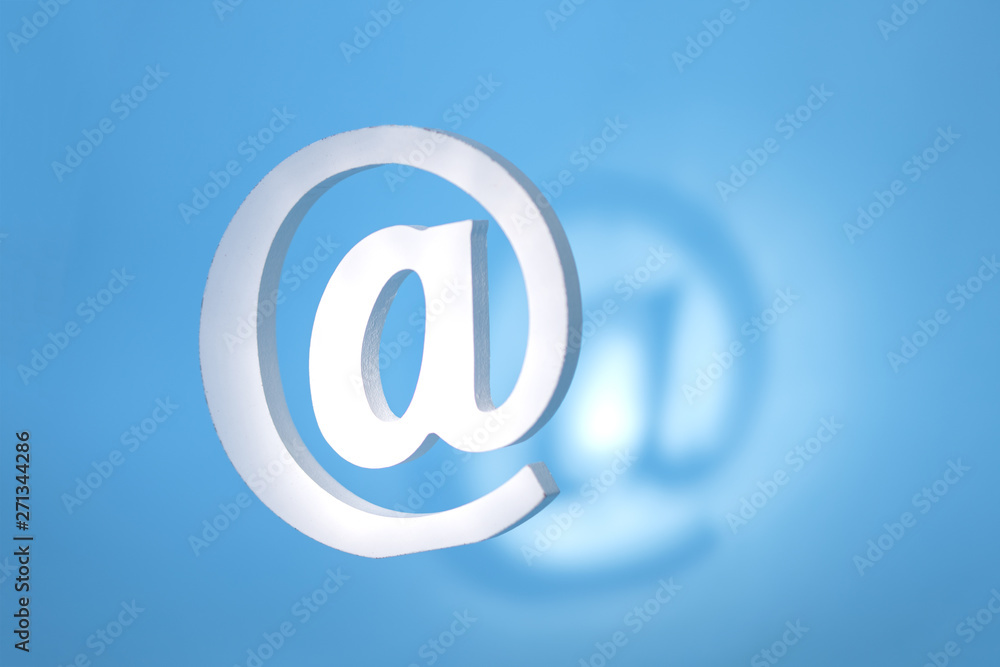 floating email sign on blue background with real shadow. Concept for email, communication or contact us floating email sign on blue background with real shadow. Concept for email, communication or contact us