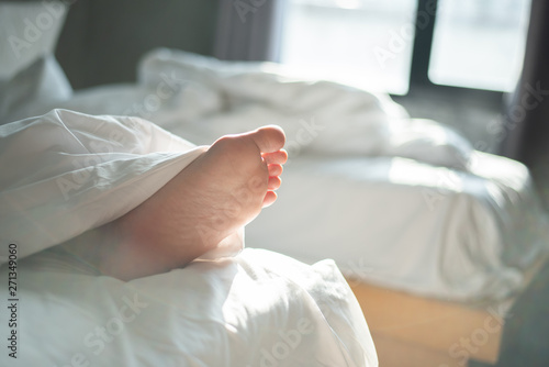 Young female sleeping in bed at home