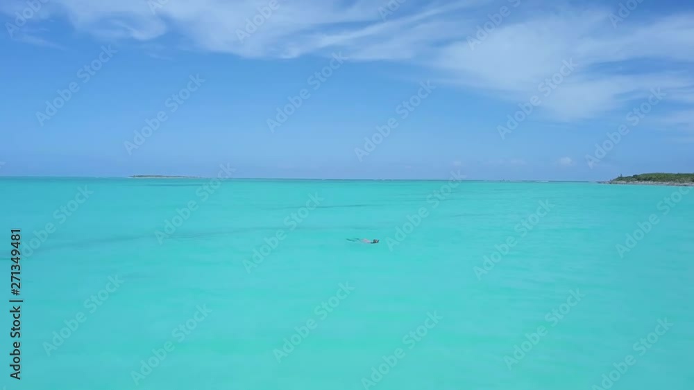 Female snorkeler in turquoise waters. exuma bahamas Female snorkeler in turquoise waters. exuma bahamas