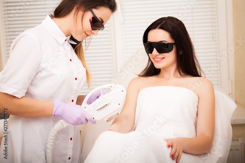 Skin care. Adult woman having laser hair removal in professional beauty salon