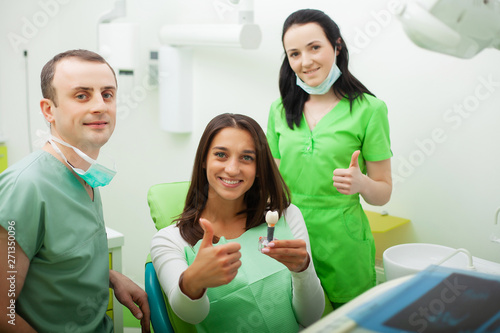 Patient in dentistry. Pretty woman visiting her dentist in clinic