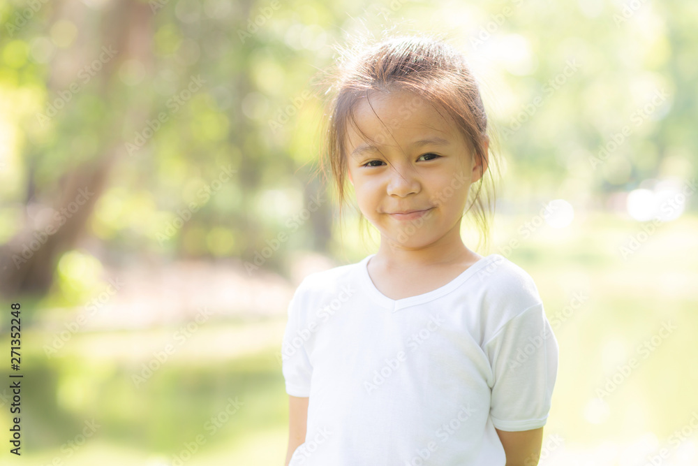 Portrait face of cute asian little girl and child happiness and fun in the park in the summer, smile and happy from asia kid and relax in the garden, lifestyle childhood concept. Portrait face of cute asian little girl and child happiness and fun in the park in the summer, smile and happy from asia kid and relax in the garden, lifestyle childhood concept.