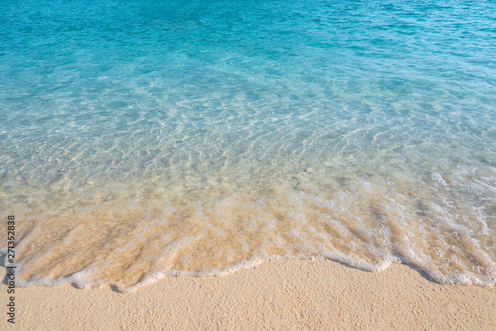 Summer concept ,Soft wave lapped the sandy beach background Summer concept ,Soft wave lapped the sandy beach background