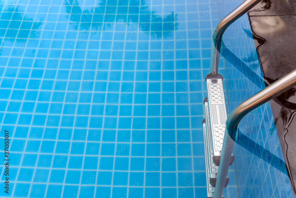 Metal ladder entrance to the swimming pool. Made of stainless steel Metal ladder entrance to the swimming pool. Made of stainless steel