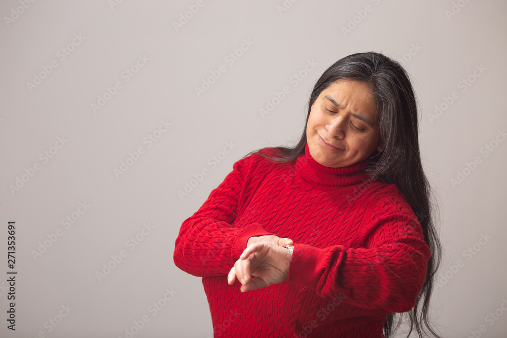 Surprised Hispanic Woman Looks At Wrist Watch Surprised Hispanic Woman Looks At Wrist Watch