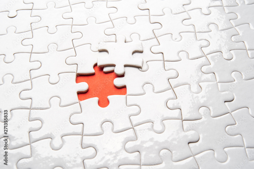 pieces of blank jigsaw puzzle for copy space, replacement words or text. Close up selective focus. pieces of blank jigsaw puzzle for copy space, replacement words or text. Close up selective focus.