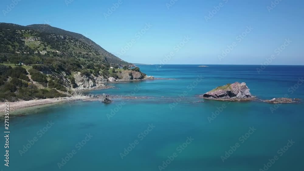 amazing blue water of warm sea near rocks of coast in sunny day, aerial view amazing blue water of warm sea near rocks of coast in sunny day, aerial view