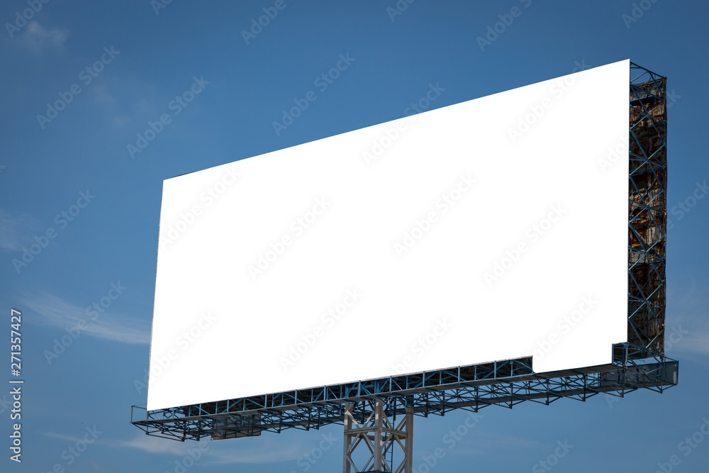 Fototapeta premium White billboard with blue sky and clouds