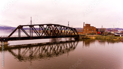 Canvas Print Flooded Mississippi River Railroad Bridge crosses near Brewery