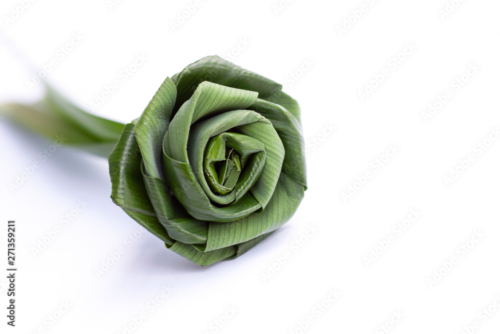 Fold the pandan leaves into roses isolated on white background. Fold the pandan leaves into roses isolated on white background.