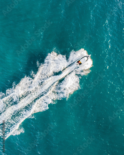 Aerial view of a fast boat in the beautiful blue ocean