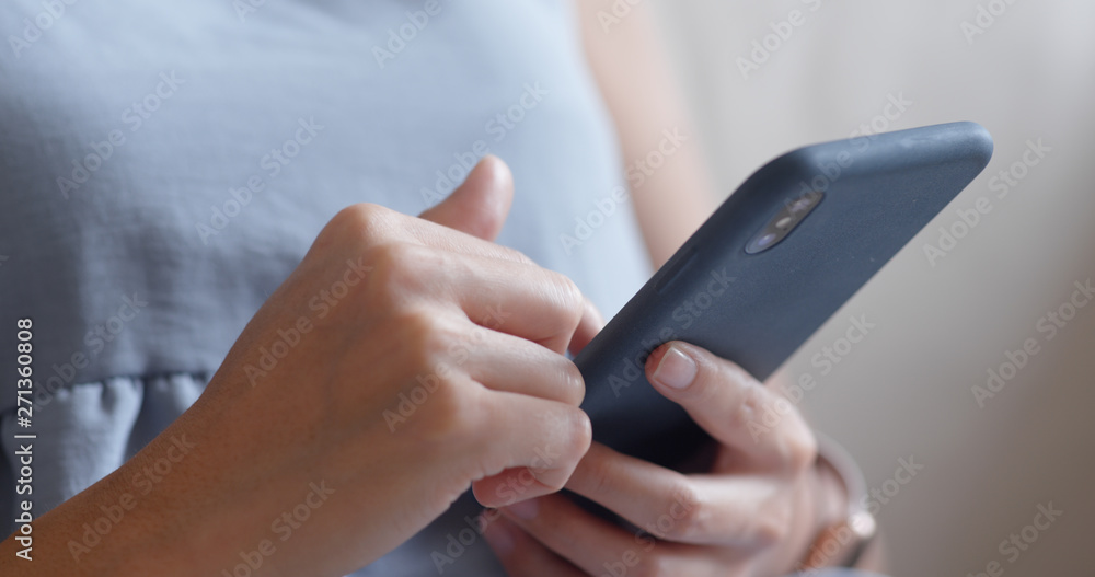 Woman use of smart phone at home Woman use of smart phone at home