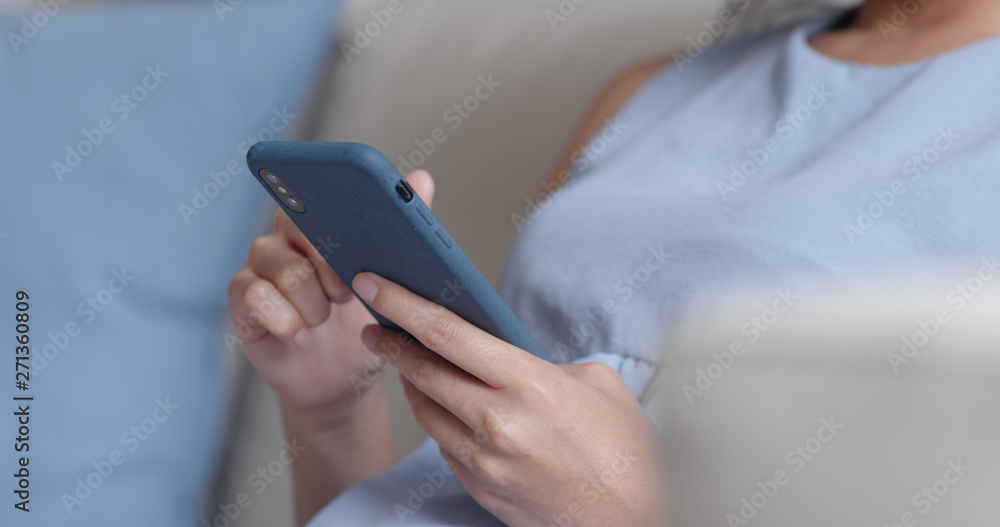 Woman use of smart phone at home Woman use of smart phone at home