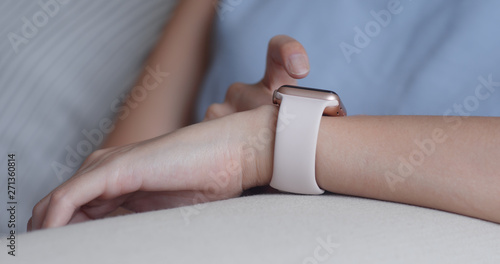 Woman use of smart watch for online