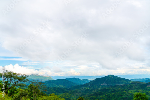 Fototapeta Naklejka Na Ścianę i Meble -  Blue sky high peak mountains fog hills mist scenery national park views at Phu Tub Berk, Khao Koh, Phetchabun Province, Thailand