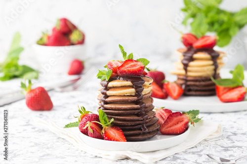 Homemade pancakes with chocolate topping and strawberries 