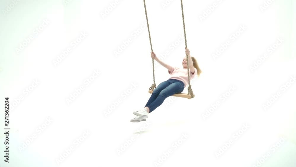 Little girl swinging on a swing Little girl swinging on a swing