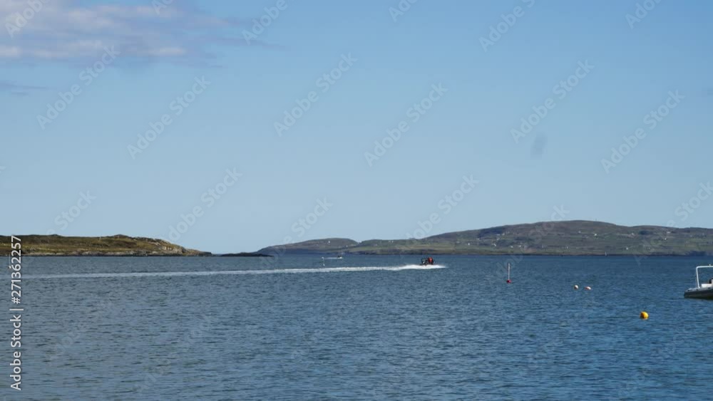 RHIB Inflatable speed boat driving out of harbour RHIB Inflatable speed boat driving out of harbour