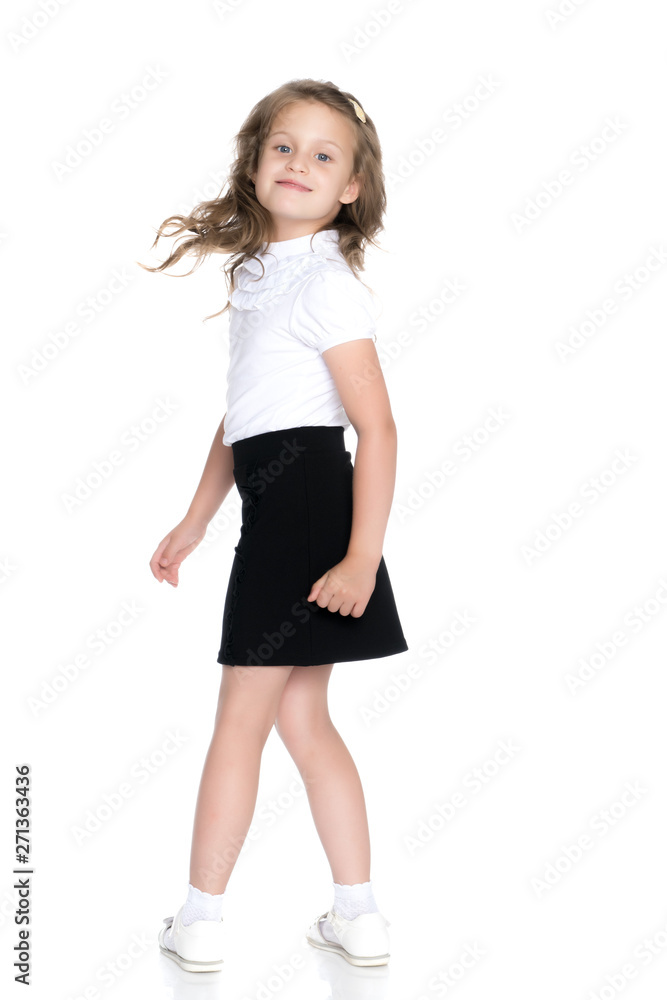 Fototapeta premium Fashionable little girl in a dress