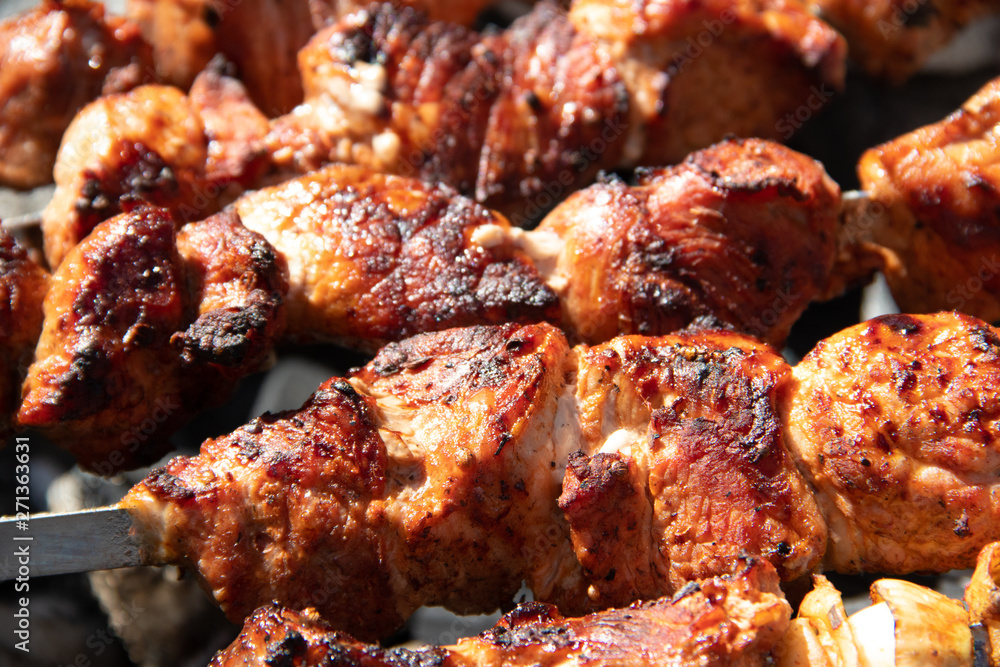 pork shish kebab on skewers. marinated meat. meat kebab. skewers on skewers. cooking on fire. pork shish kebab on skewers. marinated meat. meat kebab. skewers on skewers. cooking on fire.