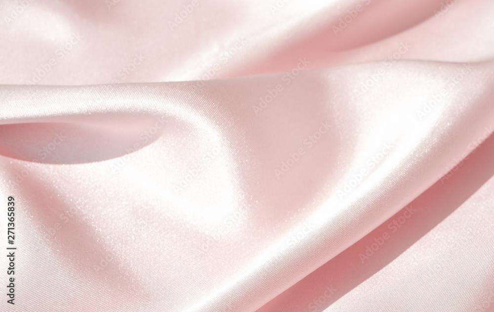 Charming smooth satin and silk pink fabric for backgrounds. Elegant abstract upholstery use for holidays Charming smooth satin and silk pink fabric for backgrounds. Elegant abstract upholstery use for holidays