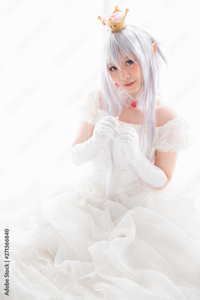 Portrait of vampire dracula young woman dress in white tone room halloween concept Portrait of vampire dracula young woman dress in white tone room halloween concept