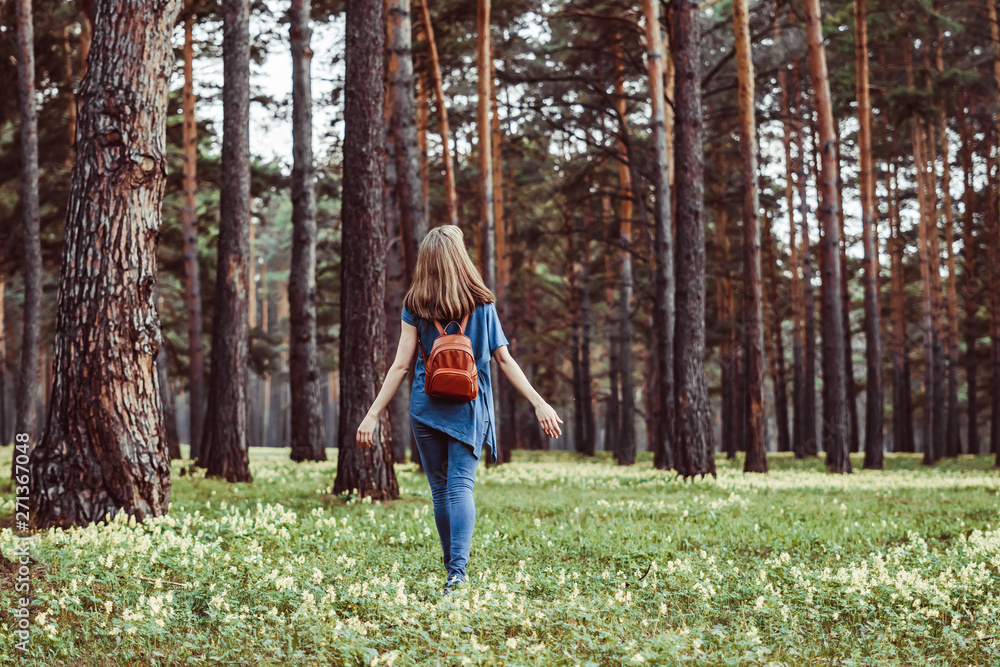 girl walking in the woods girl walking in the woods