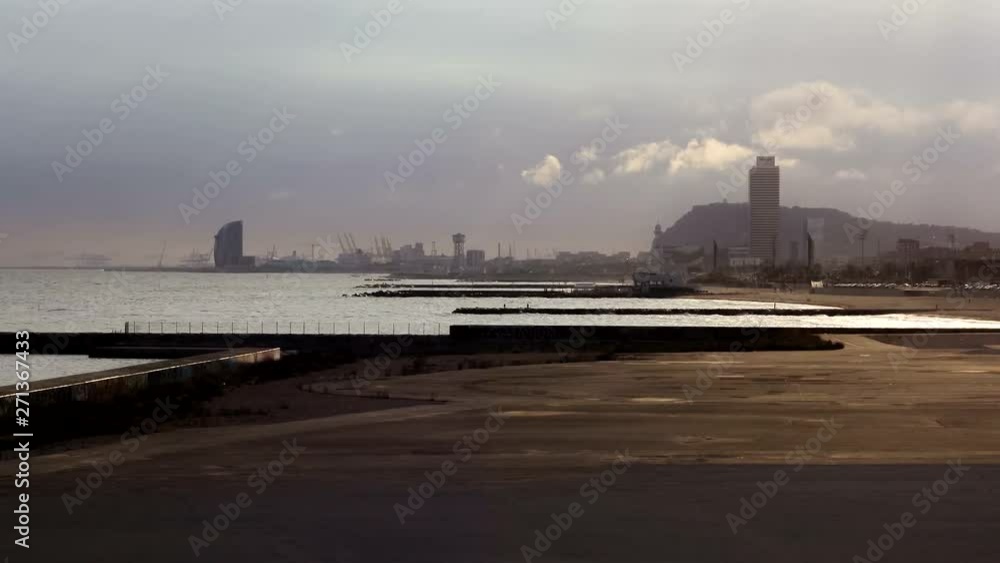 Barceloneta Beach in Barcelona with colorful sky at sunset. Seafront, beach, coast in Spain. Suburb of Barcelona, Catalonia Barceloneta Beach in Barcelona with colorful sky at sunset. Seafront, beach, coast in Spain. Suburb of Barcelona, Catalonia