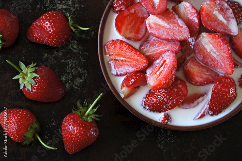 A bowl of strawberries with cream. Colorful healthy dessert. Keto diet. Keto dessert