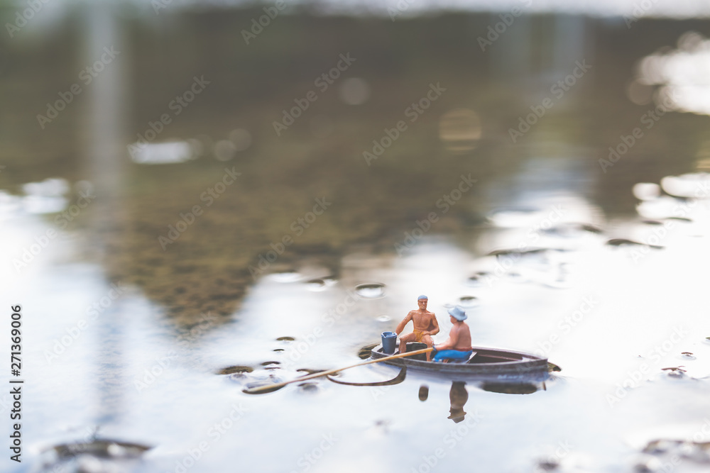 Miniature People, Miniature fishermen are fishing by boat Miniature People, Miniature fishermen are fishing by boat