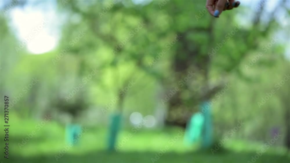 Beautiful bride and bridesmaids wearing dress and running barefoot next to each other outdoors in the park. Bridal, wedding day